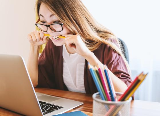 Frustrated woman looking at her laptop