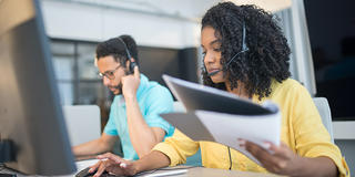 Woman talking on the phone in a contact center