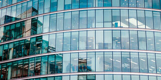Closeup of financial building with corporate offices and employees