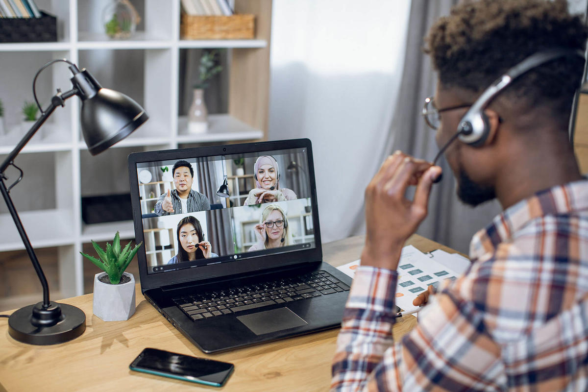 Man using a conference bridge for a video meeting