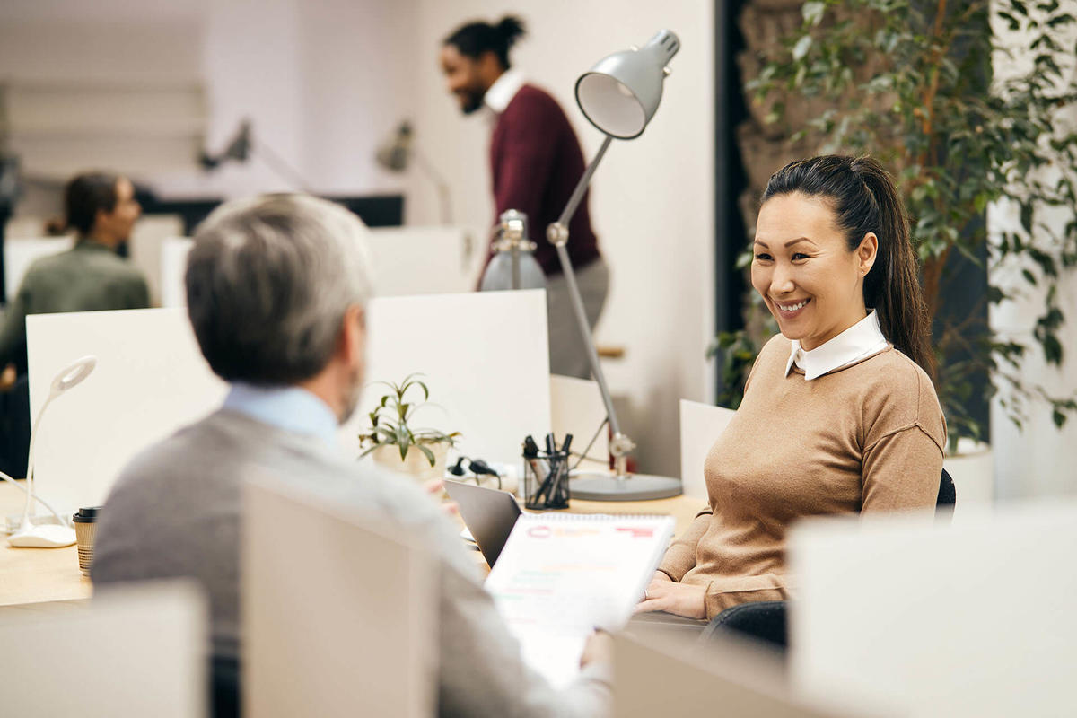 Man and woman working as a team in an office