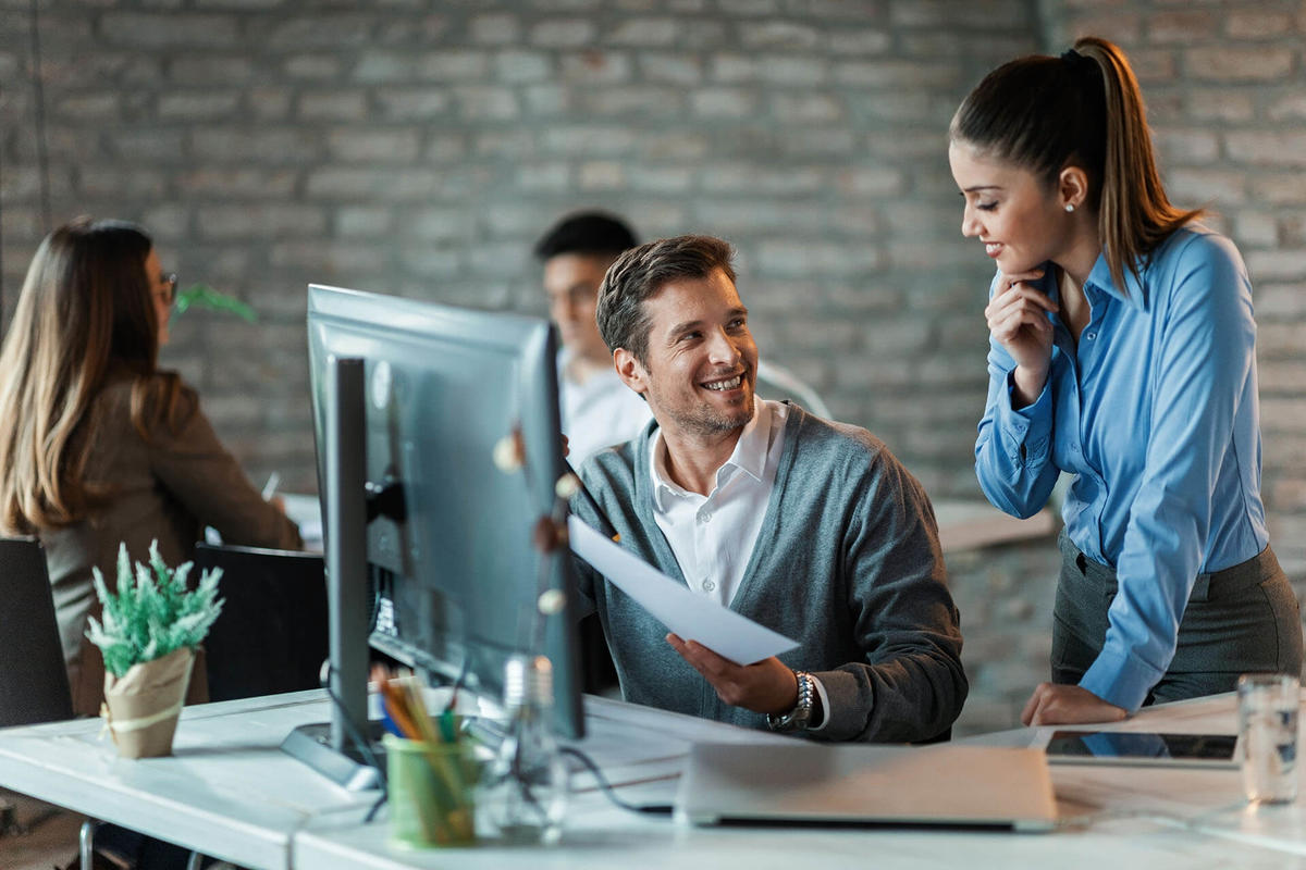 Working contact center team discussing reports