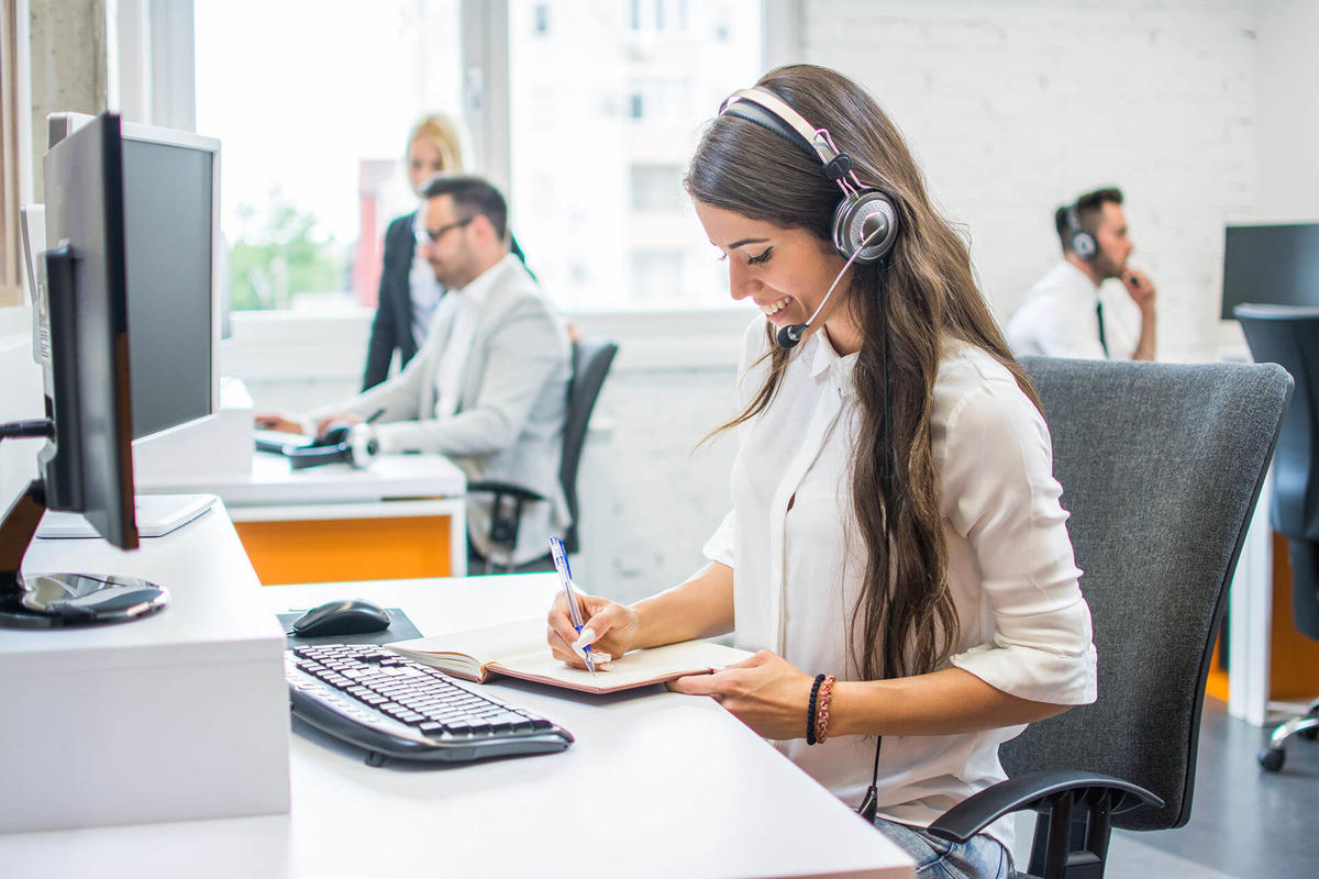 Woman with a headset working at a contact center