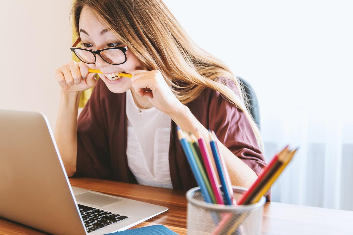 Frustrated woman looking at her laptop