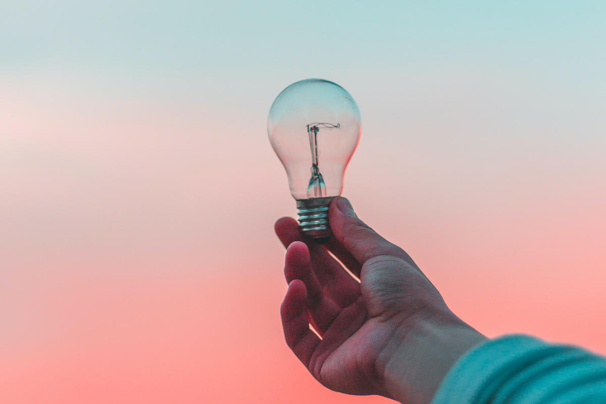 Hand holding light-bulb