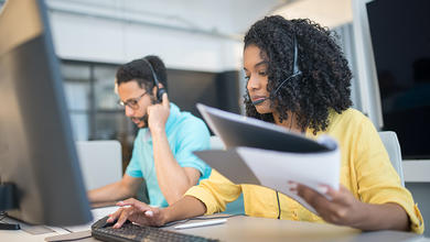 Woman talking on the phone in a contact center